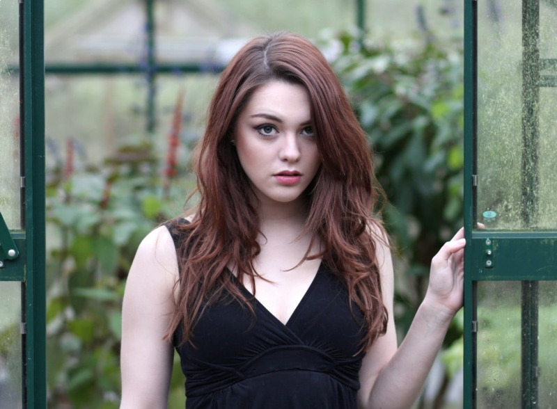 brown hair, outdoors, 720P, focus on foreground, hairstyle, hair, front view, adult, beautiful woman, Imogen Dyer, one person, long hair, young women