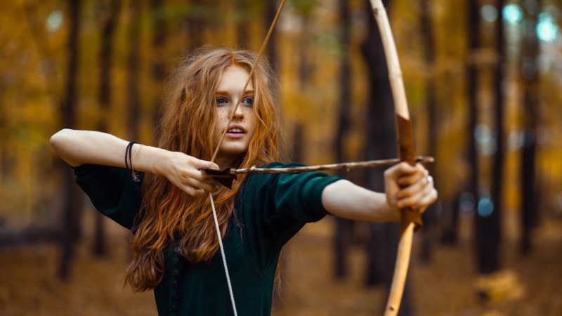 hair, weapon, activity, tree, archery Bow, summer, caucasian Ethnicity, wavy hair, holding, bow and arrow, young Adult, long hair, beige, cheerful, joy