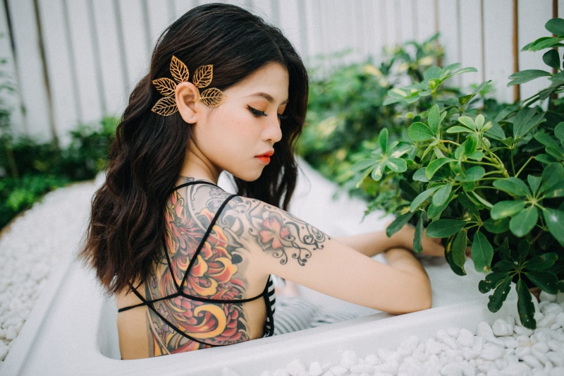 tattooed woman, beautyful, beautiful, greenery, elegance, asian Ethnicity, cute, portrait, outdoors, fence, floral, lifestyles, adult, asian woman, japanese Ethnicity