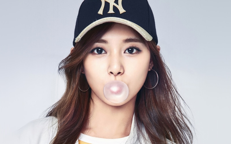 brown hair, portrait, hair, fun, front view, mlb, adult, making a face, blowing, looking at camera, girl, close-up, adolescence, headshot, one person, bubble