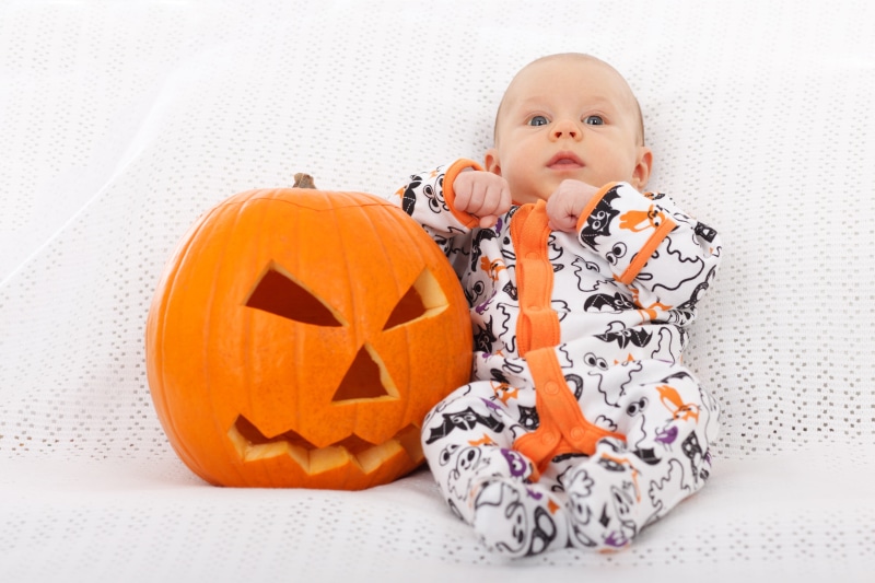 wearing, decoration, hat, one person, cute, baby, seasonal, childhood, plastic, offspring, indoors, orange, costume, halloween, fun, holiday, beside, holidays And Celebrations