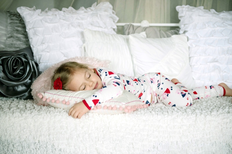  full screen, white, background, sleeping, one person, pillow, red, HD, widescreen, footie, lying down, girl, child, full length, indoors