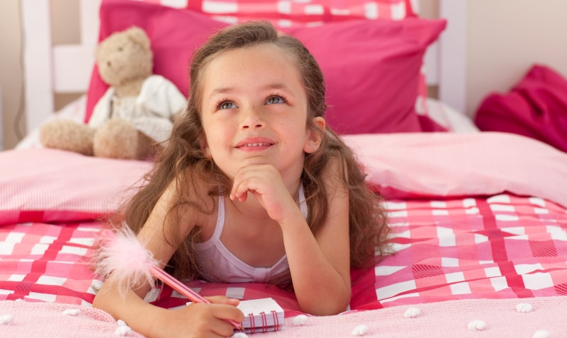 joy, education, hairstyle, beauty, lying on front, fun, dream, looking At Camera, small, girl, cute, females, top, daughter, bedtime, one Girl Only, hair