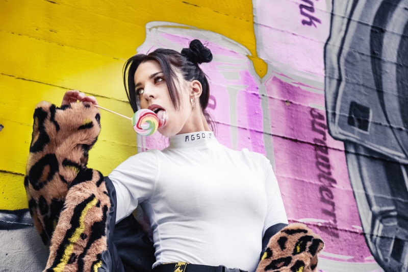 young women, young adult, wall - building feature, fashion, real people, pet owner, posing, attractive, face, vertebrate, beautiful woman, mammal, graffiti