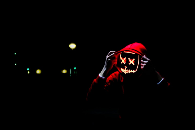 arts culture and entertainment, human body part, light - natural phenomenon, wearing, glowing, horror, human face, illuminated, night, lighting equipment