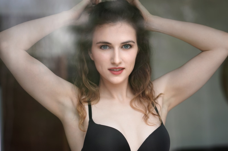 focus on foreground, one person, brown hair, arms raised, women, headshot, young adult, fashion, hair, human arm, lipstick, long hair, looking at camera