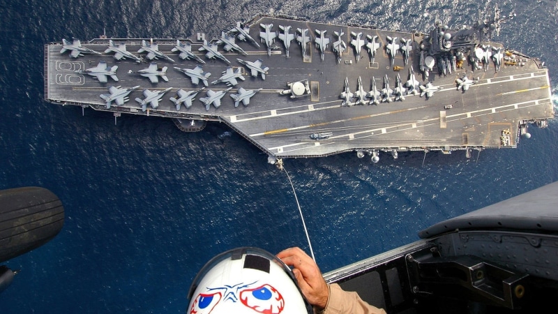 lifestyles, human body part, outdoors, flying, high angle view, aircraft carrier, aircraft, military aircraft, finger, real people, body part, human leg