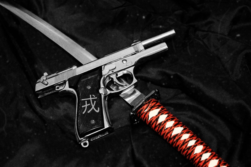 social issues, war, close-up, danger, sign, threats, gun, katana, aggression, indoors, no people, blade, criminal, warning sign, communication, still life