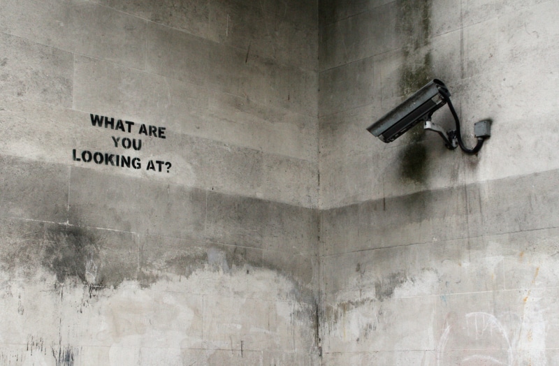 building exterior, architecture, sign, wall - building feature, western script, graffiti, surveillance, black, outdoors, old, weathered, security camera