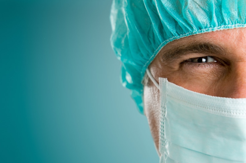 obscured face, studio Shot, copy space, doctor, looking, operating Room, equipment, uniform, expertise, caucasian Ethnicity, white, medicine, surgical Cap