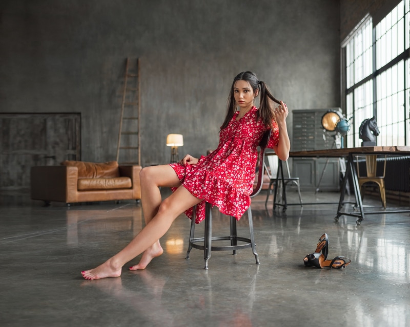 2K, model, barefoot, high heels, pigtails, red nails, chair, women indoors, sitting, couch, women, painted nails, indoors, red dress, brown eyes, touching hair