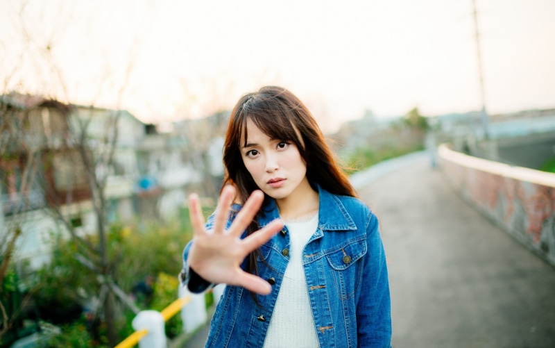 black hair, 1080P, long hair, day, medium-length hair, focus on foreground, standing, beautiful woman, bangs, outdoors, young adult, looking at camera