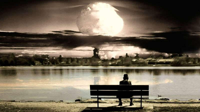 water, reflection, tranquil scene, lifestyles, lake, park bench, atomic bomb, looking, moon, sky, explosion, hat, real people, rear view, bench, one person