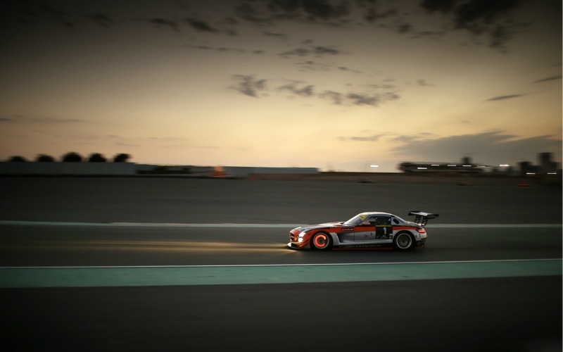 vehicle, sky, car, motor vehicle, outdoors, travel, street, transportation, nature, sunset, sport , red, racing, cloud - sky, on the move, mode of transportation