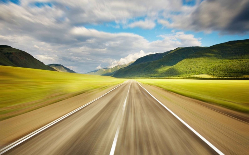 2K, motion blur, non-urban scene, blurred motion, direction, highway, day, outdoors, mountain, hills, motion, photo, blur, near, road, sky, transportation