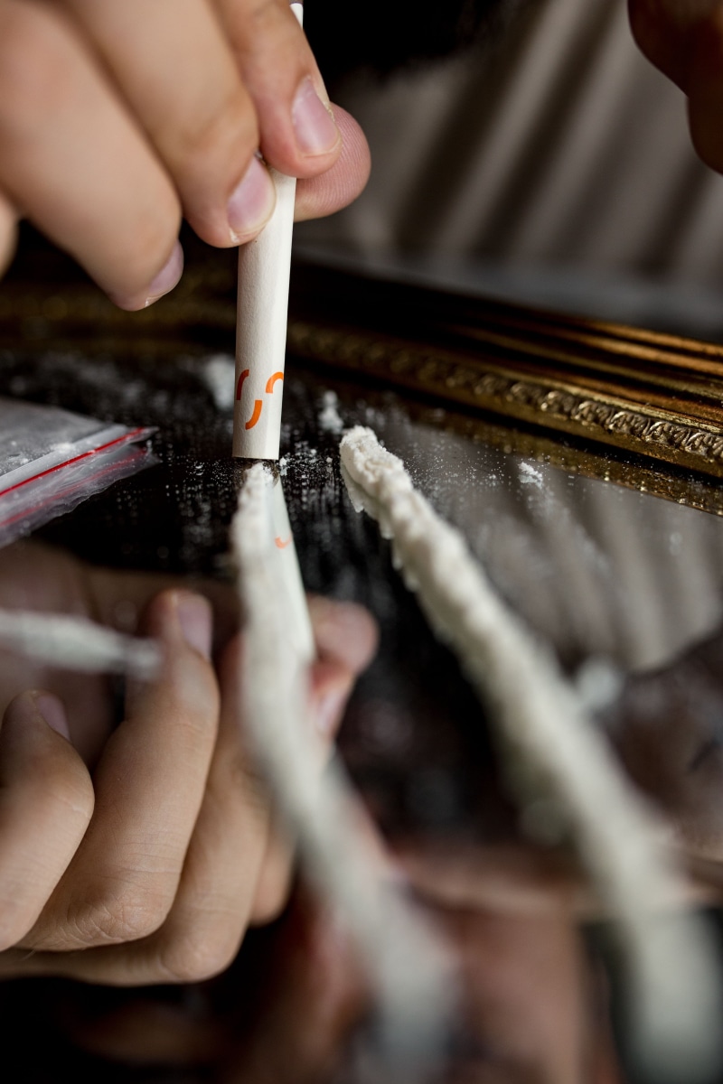 finger, one person, real people, addict, lifestyles, human body part, high angle view, crime, holding, close-up, heroin, powder, coke, criminal, unrecognizable person
