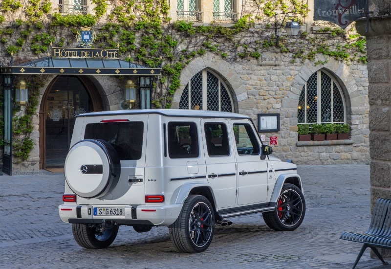 building, outdoors, motor vehicle, street, stationary, parking, land vehicle, connection, mode of transportation, car, mercedes-benz, transportation, architecture