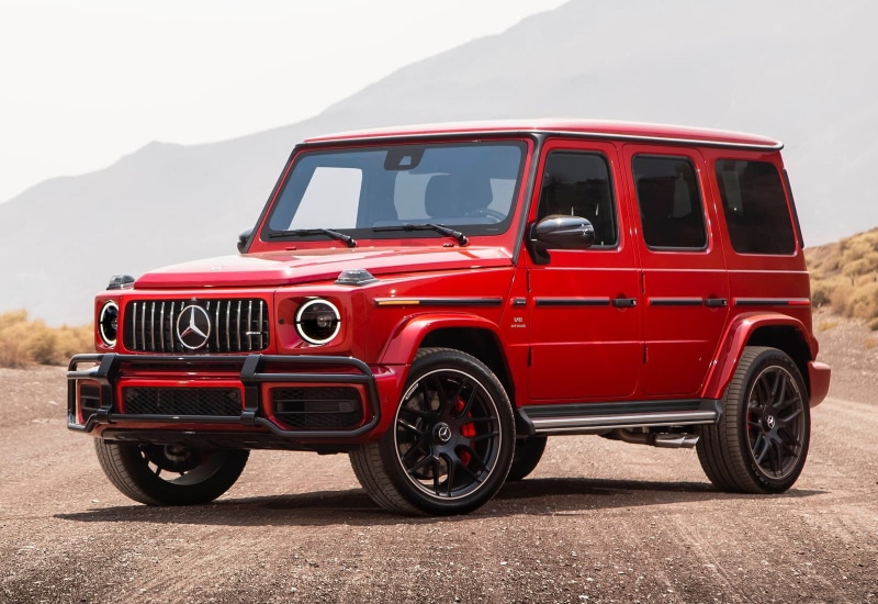 land vehicle, motor vehicle, no people, city, mountain, aggression, stationary, focus on foreground, retro styled, mode of transportation, travel, g63