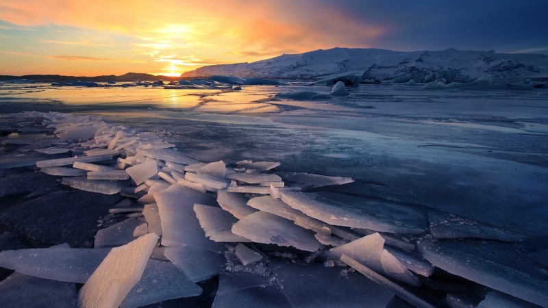 environment, reflection, iceberg, floating on water, berg, frozen lake, beauty in nature, landscape, glacier, clouds, cloud - sky, ice, winter, sky, mountain
