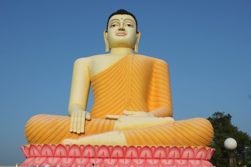 day, Temple, belief, idol, religion, creativity, low angle view, male likeness, representation, statue, no people, art and craft, clear sky, human representation