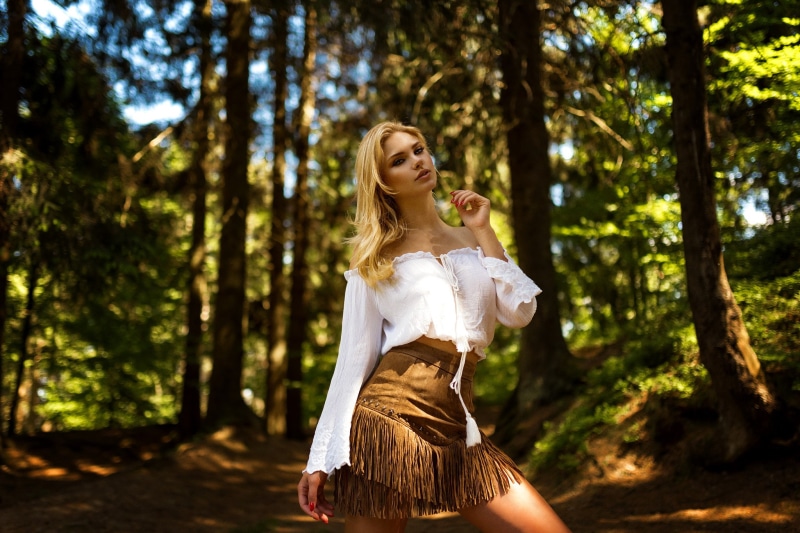hair, outdoors, one person, focus on foreground, bare shoulders, freedom, women outdoors, leisure activity, young adult, red nails, lifestyles, trees, land