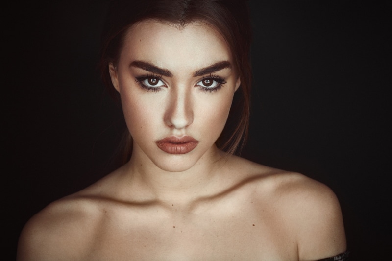 beautiful woman, beauty, human face, front view, studio shot, close-up, shirtless, bare shoulders, hairstyle, black background, face, headshot, 1080P