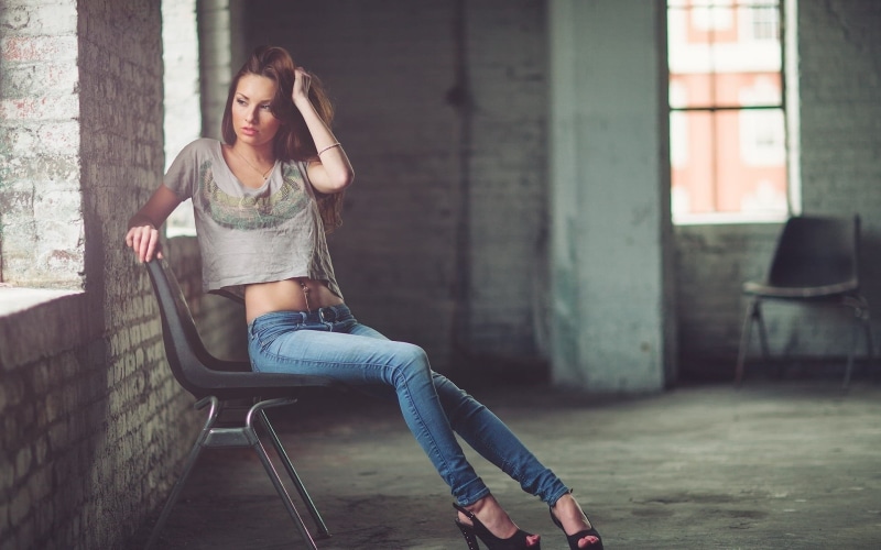 real people, sitting, day, long hair, hairstyle, young women, beautiful woman, jeans, architecture, high heels, full length, women, window, lifestyles