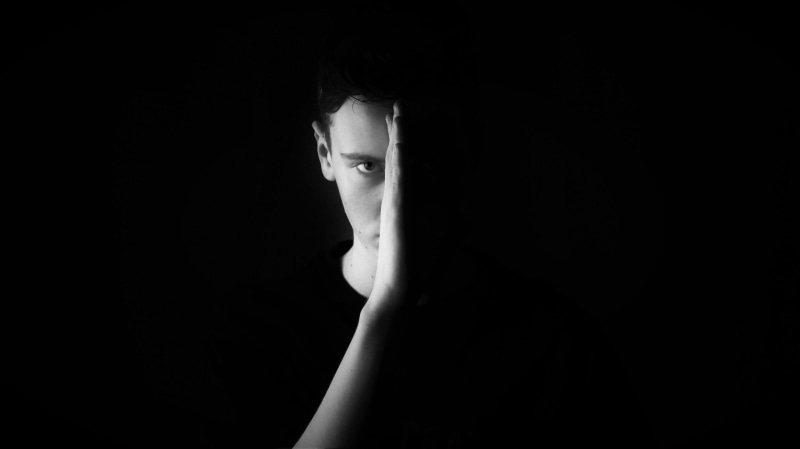 portrait, photo, profile, body part, photoshoot, looking at camera, one person, male, man, studio shot, black-and-white, black background, human body part