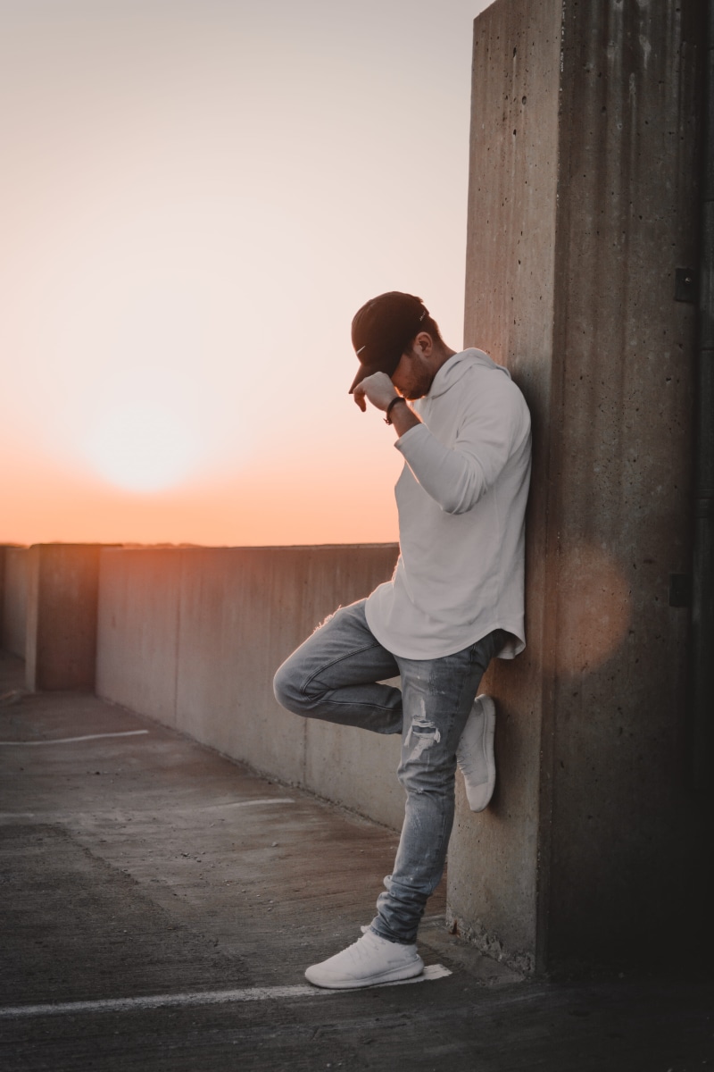 looking, side view, wall, real people, teenager, dusk, standing, sunset, pillar, lifestyles, casual clothing, architecture, young men, 5K, hoodie, nature