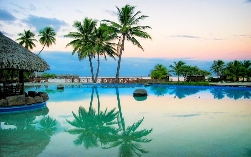swimming pool, sky, pool, beauty in nature, summer, two, no people, landscape, trees, plant, tropical climate, coconut, coconut palm tree, architecture