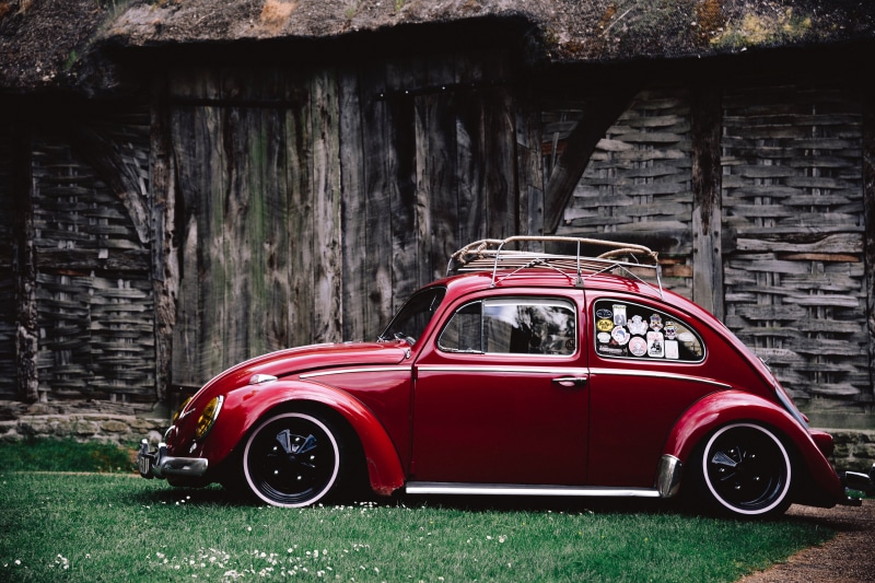 motor vehicle, vintage, old-fashioned, red, coupe, green, abandoned, building exterior, car, no people, transportation, building, auto, obsolete, landscape