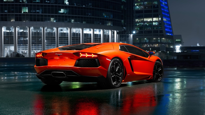 city, 4K, building exterior, outdoors, lamborghini, illuminated, car, city car, red, automotive design, mode of transportation, orange color, lamborghini aventador