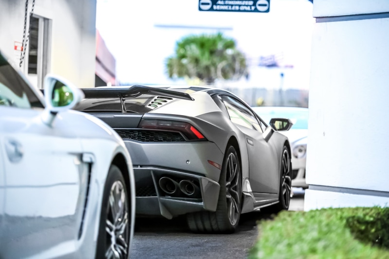 silver colored, mode of transportation, travel, vehicle, Lamborghini, focus on foreground, sign, car, no people, Lamborghini Huracan, day, selective focus
