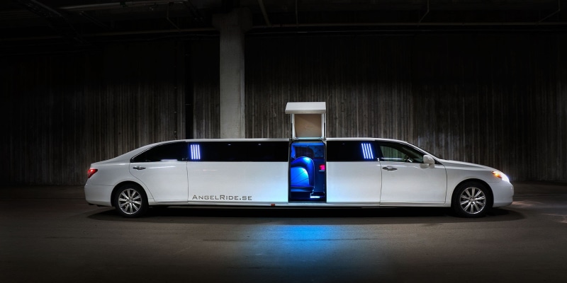 door, vehicle, wealth, garage, wheel, car, architecture, parked, transportation, lights, luxurious, side view, travel, long, limo, retro styled, blue, opened