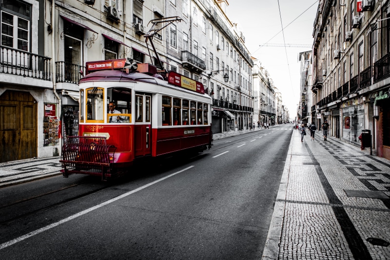 building, raod, mode of Transport, track, buildings, street, tram, road between, built Structure, incidental people, city, transportation, famous Place