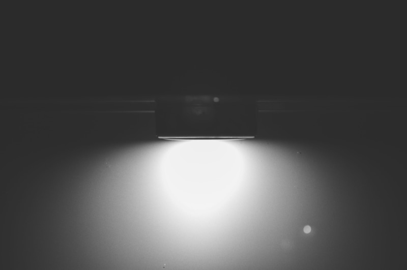 studio shot, dark, black, white, no people, illuminated, reflection, indoors, black background, copy space, spotlight, light - natural phenomenon, stage