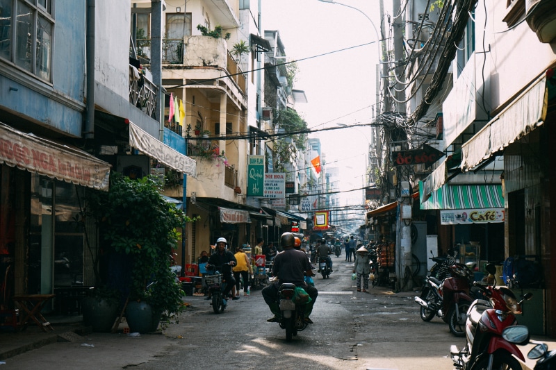 land vehicle, group of people, built structure, building, men, saigon, city, people, building exterior, transportation, the way forward, vietnam, real people