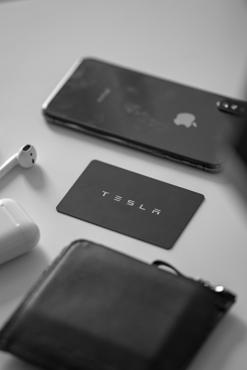tesla, text, computer hardware, no people, close-up, ipod, mobile phone, smart phone, business, phone, selective focus, still life, touch screen, camera