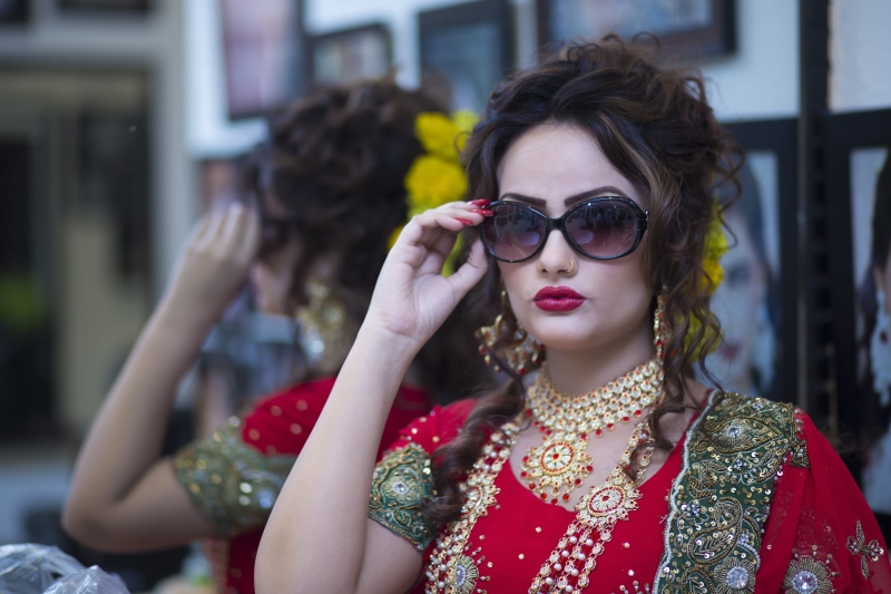 fashion, traditional wear, make-up, jewellery, pose, bridal, wear, holding, headshot, one person, make up, costume, red, lifestyles, women, black, glasses