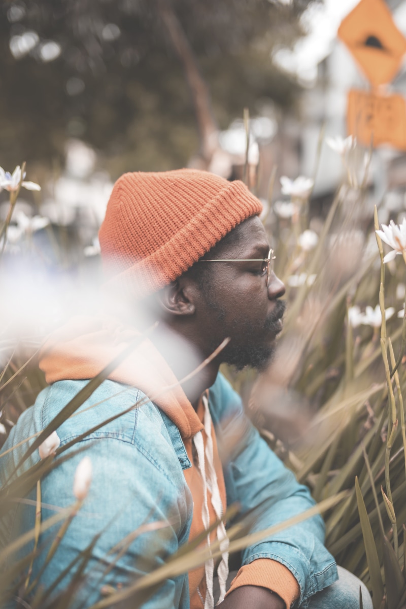 5K, white, cap, beside, leisure activity, male, beard, adult, orange, outdoors, looking, looking away, jacket, denim, petaled, grass, photography, one person