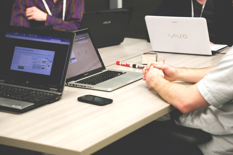 midsection, working, hand, team, surfing the net, laptops, computers, sitting, technology, computer keyboard, iphone, computer, beside, pen, macbook, meeting