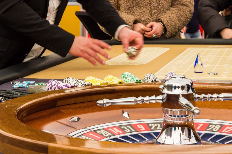 risk, success, leisure Games, game casino, luck, chance, pay, playing, indoors, win, poker - Card Game, adult, black, close-up, table, sitting, leisure activity