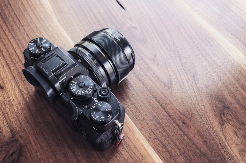 high angle view, obsolete, close-up, retro, objects, still life, technology, wood, black, wooden table, single Object, camera - Photographic Equipment