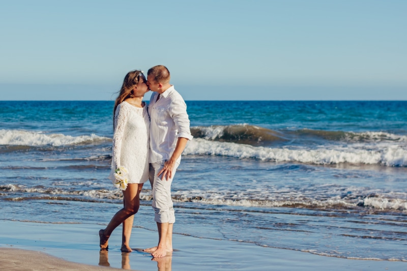 females, shoreline, caucasian Ethnicity, water, lifestyles, men, summer, bonding, couple - Relationship, sky, togetherness, standing, woman, emotion, canary islands