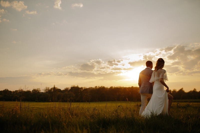 dress, beauty, married, cheerful, people, walks, females, emotion, sunset, nature, young Adult, grass, embracing, bouquet, celebration, 5K, sunrise, wedding