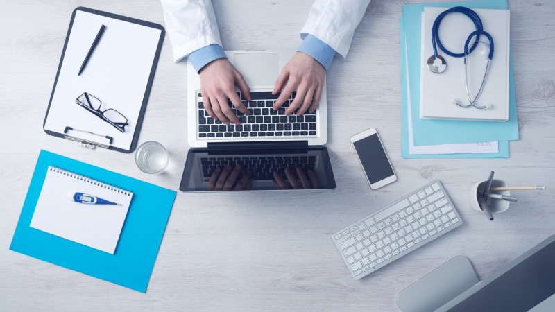 indoors, using laptop, one person, communication, working, typing, office, technology, medical care, adult, one man only, computer keyboard, connection