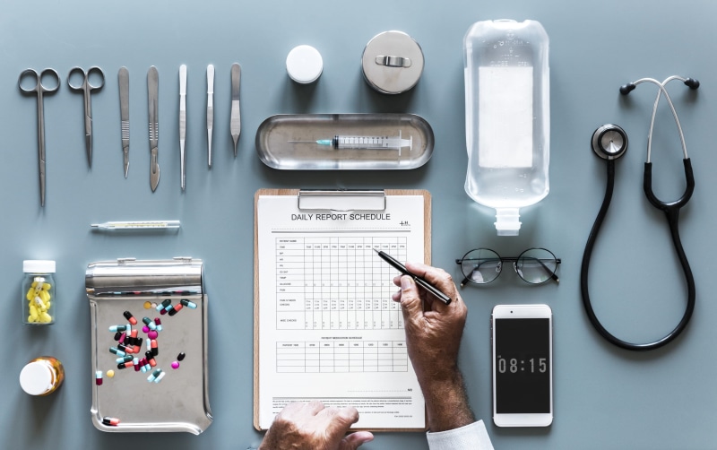 writing, doctors, aerial, health, person, drugs, hands, stethoscope, directly above, equipment, indoors, technology, holding, flatlay, aerial view, human body part
