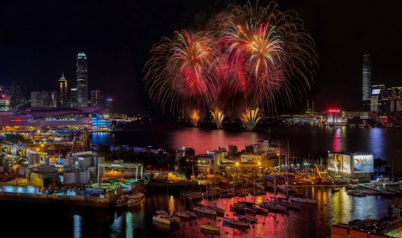 multi colored, river, illuminated, firework, water, no people, office building exterior, Hong Kong, outdoors, night, waterfront, 4K, motion, sparks, built structure