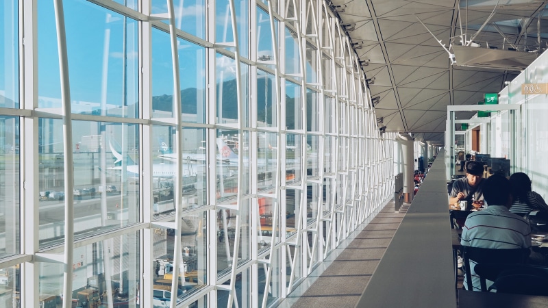 lifestyles, reflection, breakfast, incidental people, hong kong international airport, adult, glass, building exterior, lantau island, glass - material