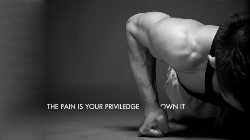 monochrome, studio shot, hairstyle, adult, indoors, body part, communication, muscular build, western script, pain, young adult, sitting, motivational